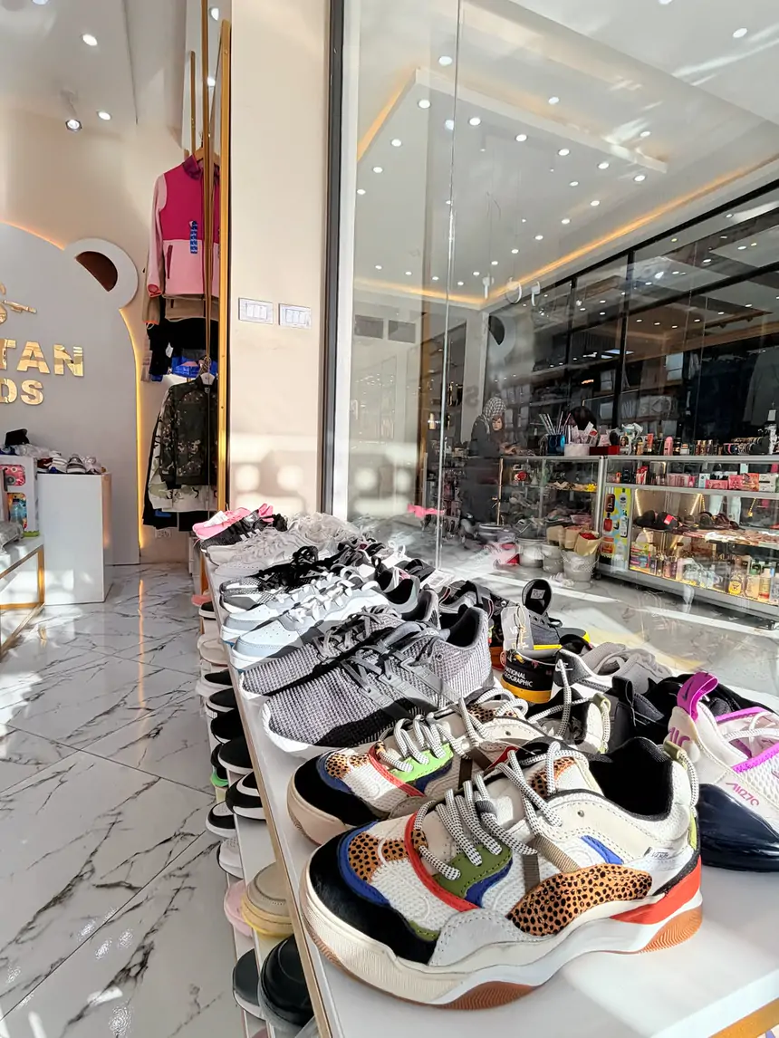 Rows of children's sneakers on the shoe shelf at Sultan Kids